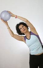 woman holding a ball for exercise